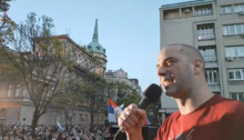 Damnjan Knežević, leader of the People's Patrol, speaking at a pro-Russian protest in April 2022