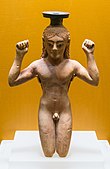 Ancient Greek perfume bottle in shape of an athlete binding a victory ribbon around his head; circa 540s BC; Ancient Agora Museum (Athens)