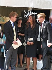 Middleton in conversation with Prince Harry outside St George's Chapel, Windsor Castle in 2008
