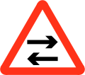 Two way traffic crosses one way road