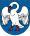 A coat of arms depicting a white bird with wings outspread, a red beak, and red feet all on a dark blue background