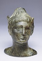 Bronze perfume container in the form of a deity with winged helmet