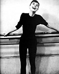 Hepburn in a black polo neck and black trousers during rehearsals in 1956