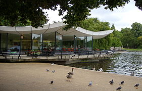 The modernist architecture of the Dell Restaurant, situated on the northern end of the dam, dominates the eastern end of the lake.