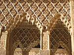 Details of the stucco yeseria decoration, with sebka motif, arabesques, and muqarnas sculpting
