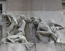The group to the right. The geometric line is reversed. The man at the front is stooped and his hands grip the edge of the entrance. Behind him one woman lies prostrate whilst another is knelt in prayer. Next we see a man supporting a woman and at the end a woman turns appearing to blow a farewell kiss.