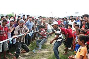 A tug of war by men commemorating independence day