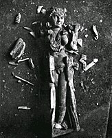 The statuette upon discovery in Pompeii, before reconstitution.