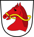 Gemeinde Haibach In Silber ein roter Pferdekopf mit goldenem Zaumzeug.