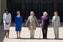 Five first ladies stand in a row