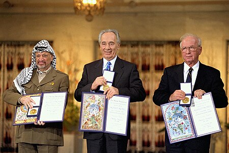 Yasser Arafat, Shimon Peres and Yitzhak Rabin receiving the Nobel Peace Prize following the Oslo Accords (nominated by Andrew J.Kurbiko)