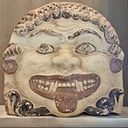 Fig. 17 Gorgoneion with earrings; terracotta antefix from the Acropolis of Athens, Acropolis Museum 78–87, K 292–29 (second half of the sixth century BC)[80]