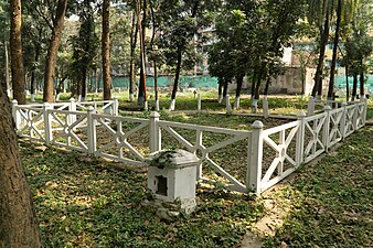 White stone fence demarcates the area of the mass grave from 1943