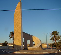 Monument at eastern entry to Souk Lahad with anti-Ben Ali graffiti