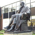 The statue of John Dalton by William Theed outside the university's building in Chester Street
