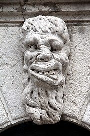 Mascaron adorning the front door of the campanile.