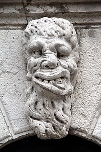 Grotesque adorning the door of the bell tower of the church Santa Maria Formosa in Venice.