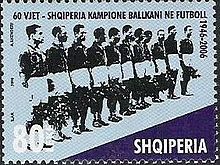 A stamp featuring a football team lining up prior to a match