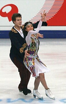 Figure skaters in costumes inspired by traditional Uzbek clothes