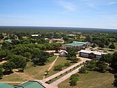Aerial photograph of a university in Bulawayo, Zimbabwe surrounded by many trees.