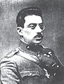 Colonel D. Ambelas, showing the usual way of wearing the Silver and Gold grades of the Cross of Valour on field uniforms, passed through the second buttonhole