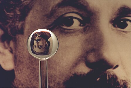An image of one of the most accurate human-made spheres, as it refracts the image of Einstein in the background. This sphere was a fused quartz gyroscope for the Gravity Probe B experiment, and differs in shape from a perfect sphere by no more than 40 atoms (less than 10 nm) of thickness. It was announced on 1 July 2008 that Australian scientists had created even more nearly perfect spheres, accurate to 0.3 nm, as part of an international hunt to find a new global standard kilogram.[20]