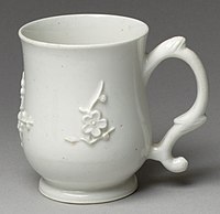 Mug with sprigged Chinese-style plum-blossom decoration, an example of Bow's cheaper wares.[37]