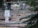 Flood waters rush in from the Sheep River into a local Okotoks campground (June 20, 2013).