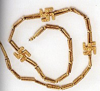 Golden necklace of three Swastikas from Marlik, kept at the National Museum, Tehran.