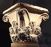 The capital of a Corinthian column, showing detail of leaf carvings