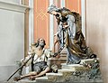 Woodcarved polychrome sculpture of St Elizabeth with a beggar, by Rudolf Moroder, Parish church of Urtijëi, Italy