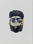 Face bead; mid-4th–3rd century BC; glass; height: 2.7  cm; Metropolitan Museum of Art
