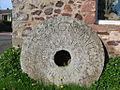 Ornamental millstone with legend: Preston Mill National Trust for Scotland