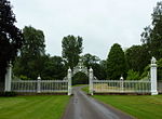 Gates and screen across the main (south-west) approach to Cholmondeley Castle