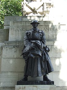 Bronze statue of a soldier on outdoor stonework