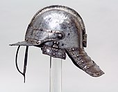 A photograph of a metal helmet.