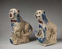 Early pair, c. 1750, copying Chinese figures. salt-glazed stoneware, c. 8.5 inches tall