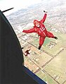 A Red Berets parachute rigger during a jump from a Dakota
