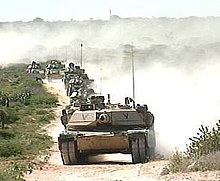 Tanks roll through desert