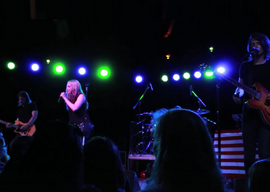 The Never Ending performing in 2014. From left to right: Carman Kubanda, Debby Ryan, Johnny Franco and Kyle Moore