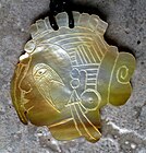 Shell gorget carved by Benny Pokemire (Eastern Band Cherokee)