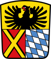 Landkreis Donau-Ries Geteilt: oben in Gold ein wachsender, rot bewehrter schwarzer Adler; unten gespalten; vorne in Rot ein durchgehendes goldenes Andreaskreuz, hinten die bayerischen Rauten.