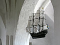 A model ship (probably expressing thanks for help during a storm) hanging in a Söderköping church