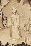 Trần Anh Tông wearing a "áo viên lĩnh" and outside a "áo giao lĩnh" in the calligraphy painting Trúc Lâm đại sĩ xuất sơn đồ (The painting of Trúc Lâm the Great Master),14th century.