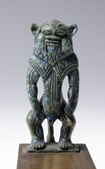 Amulet depicting the god Bes, blue Egyptian faience, between 1540 and 1076 BC, New Kingdom. Museo Egizio, Turin.