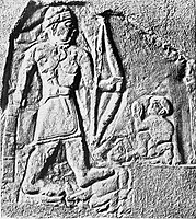 Relief of Tardunni, a possible Lullubi ruler, also holding weapons and trampling foes, with an inscription in Akkadian.