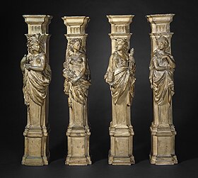 Four plaster columns, depicting women symbolically representing the continents of America, Africa, Europe, and Asia, respectively