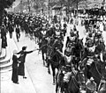 French cuirassiers, wearing breastplates and helmets, parade through Paris on the way to battle, August 1914.