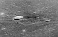 Oblique view of lunar dome near Messier in Mare Fecunditatis. Note dark 'halo' deposits. The crater left of center is unrelated (formed after the dome).