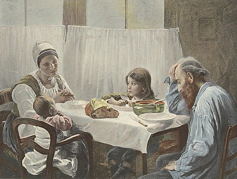 A family of four eating at a table